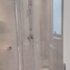 "quarter-circular-shower-cubicle-with-sliding-doors"
