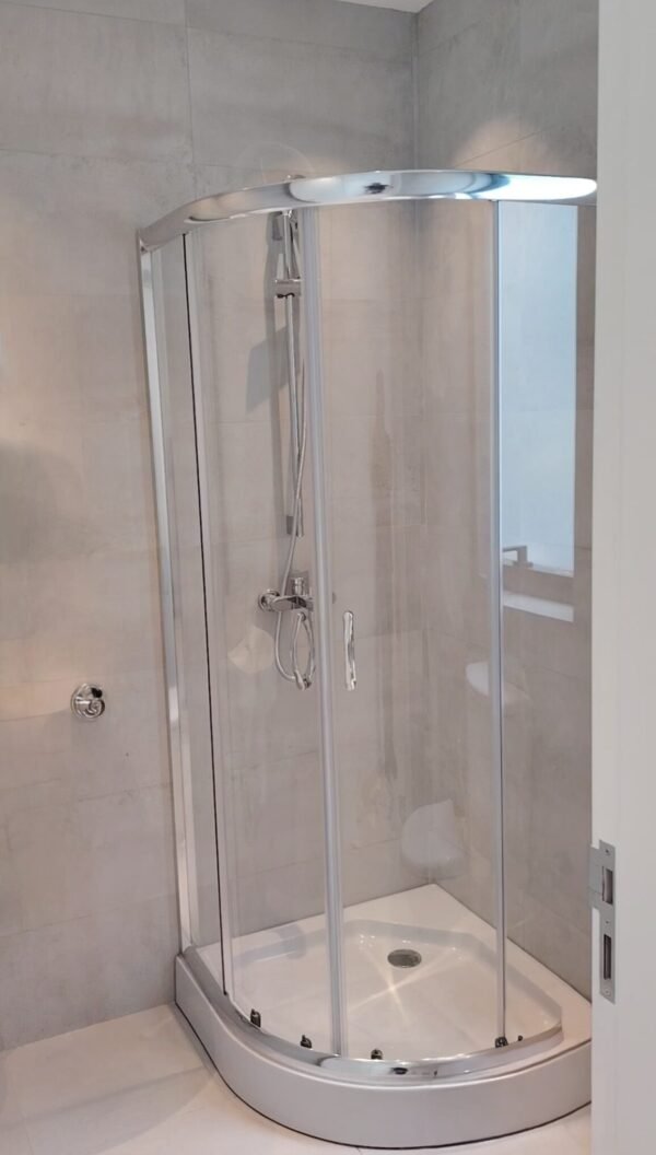 "quarter-circular-shower-cubicle-with-sliding-doors"