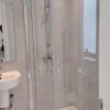 "corner-shower-enclosure-with-sliding doors"